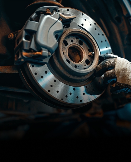 Brake disc and caliper being serviced